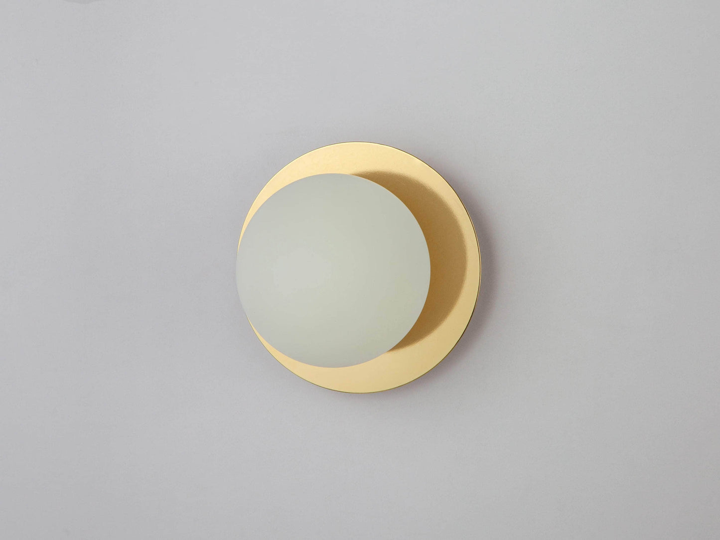 Brass opal disc wall light