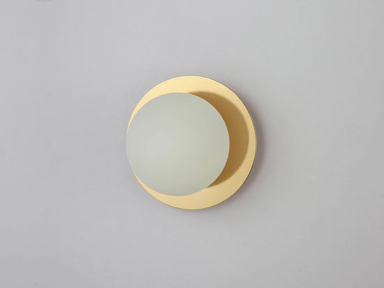 Brass opal disc wall light