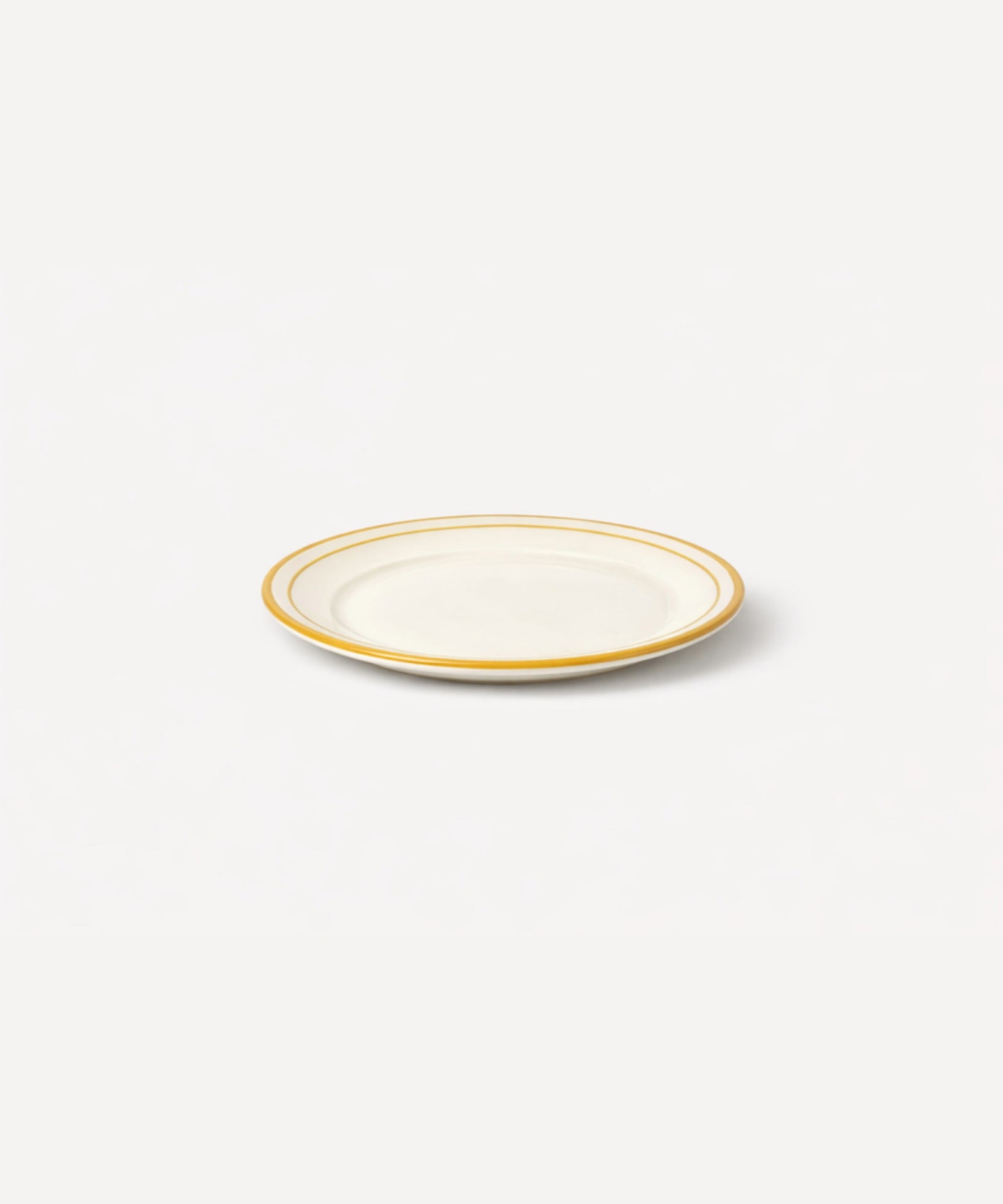 Rim Bread Plate in Golden Yellow — slim hand-painted band on a crisp white ground, Carmen del Viboral ceramic