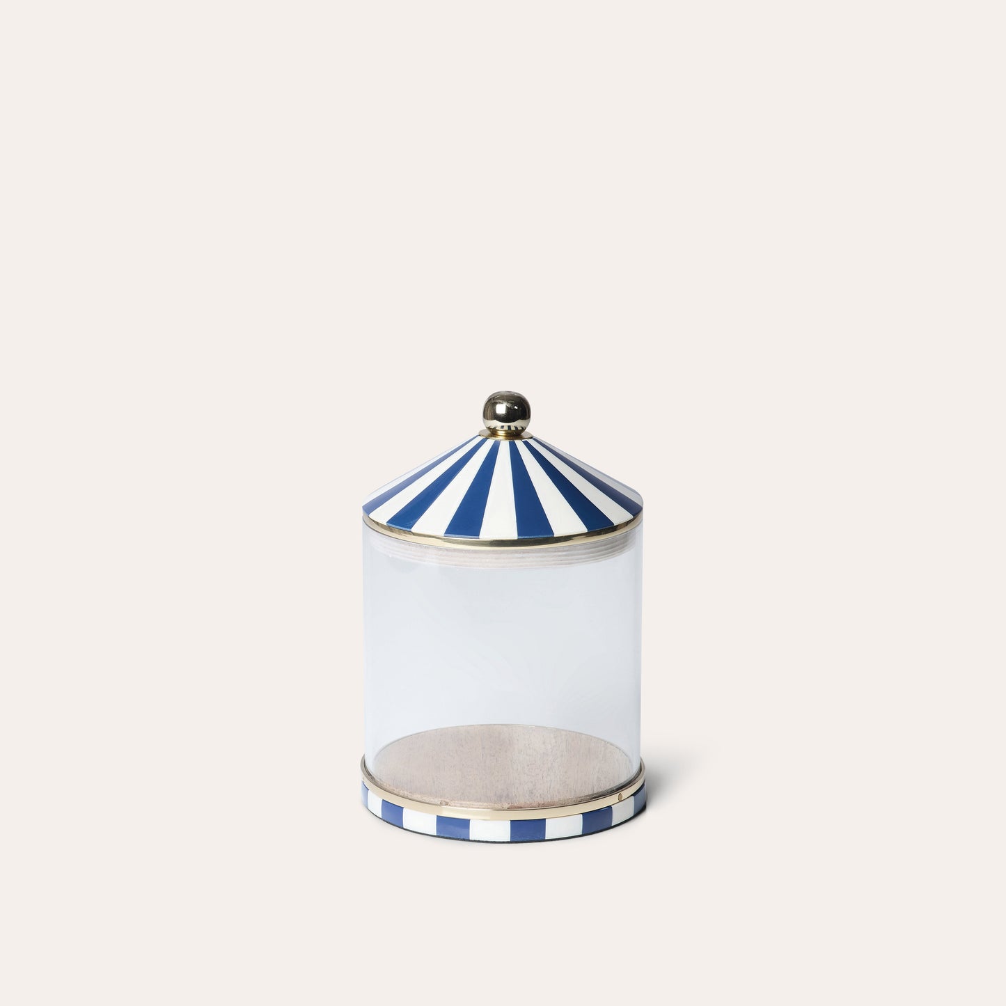 A clear acrylic storage jar with blue and white striped lid and base