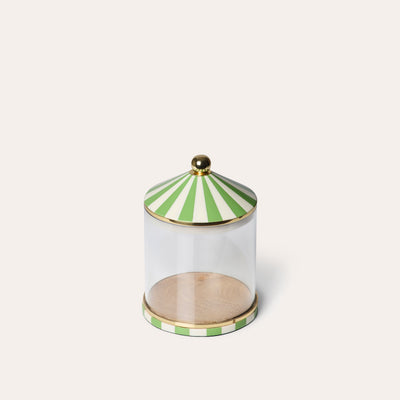 A clear acrylic storage jar with green and white striped lid and gold accents around the lid and base.