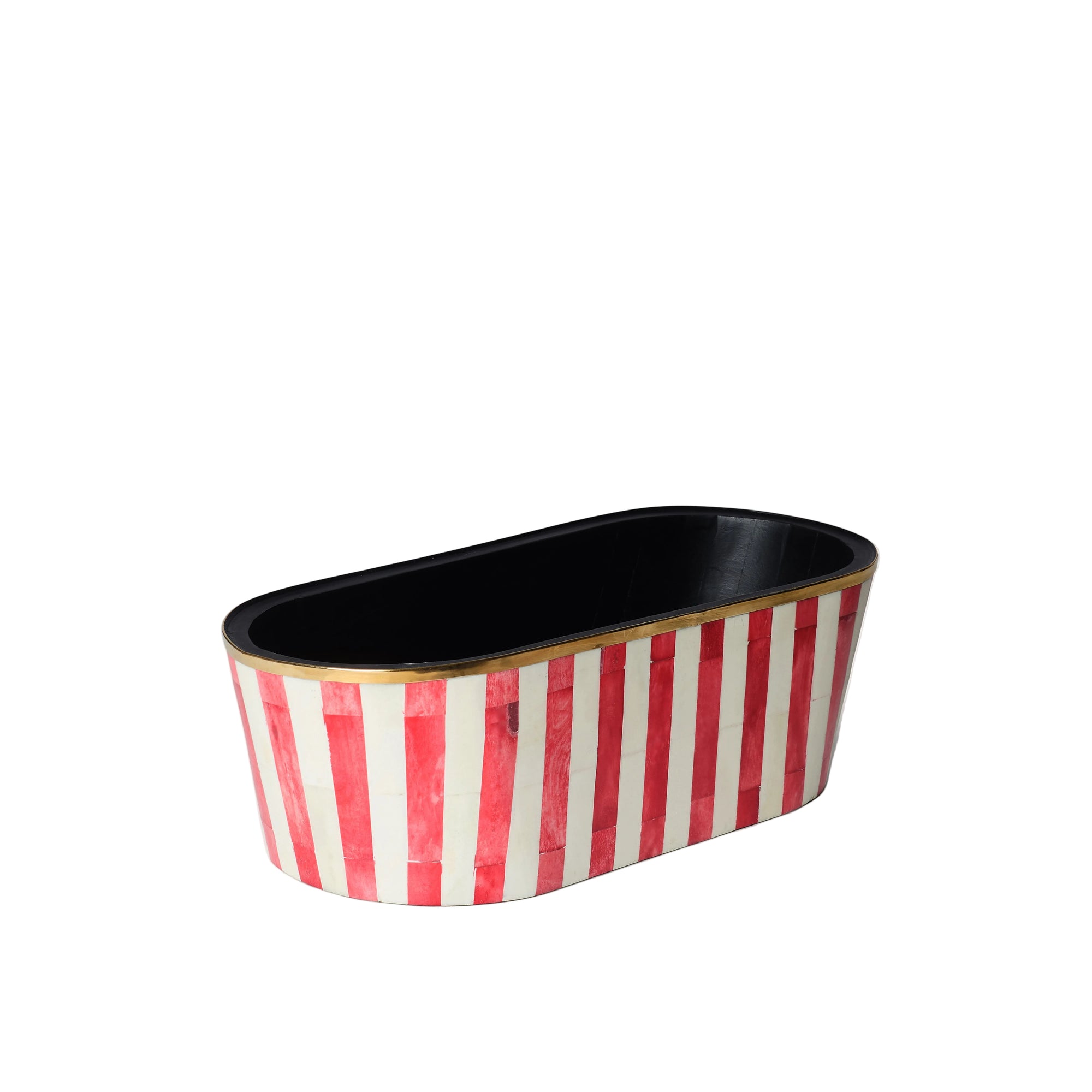 An oblong oblong planter with red and white striped pattern and a black interior lining.