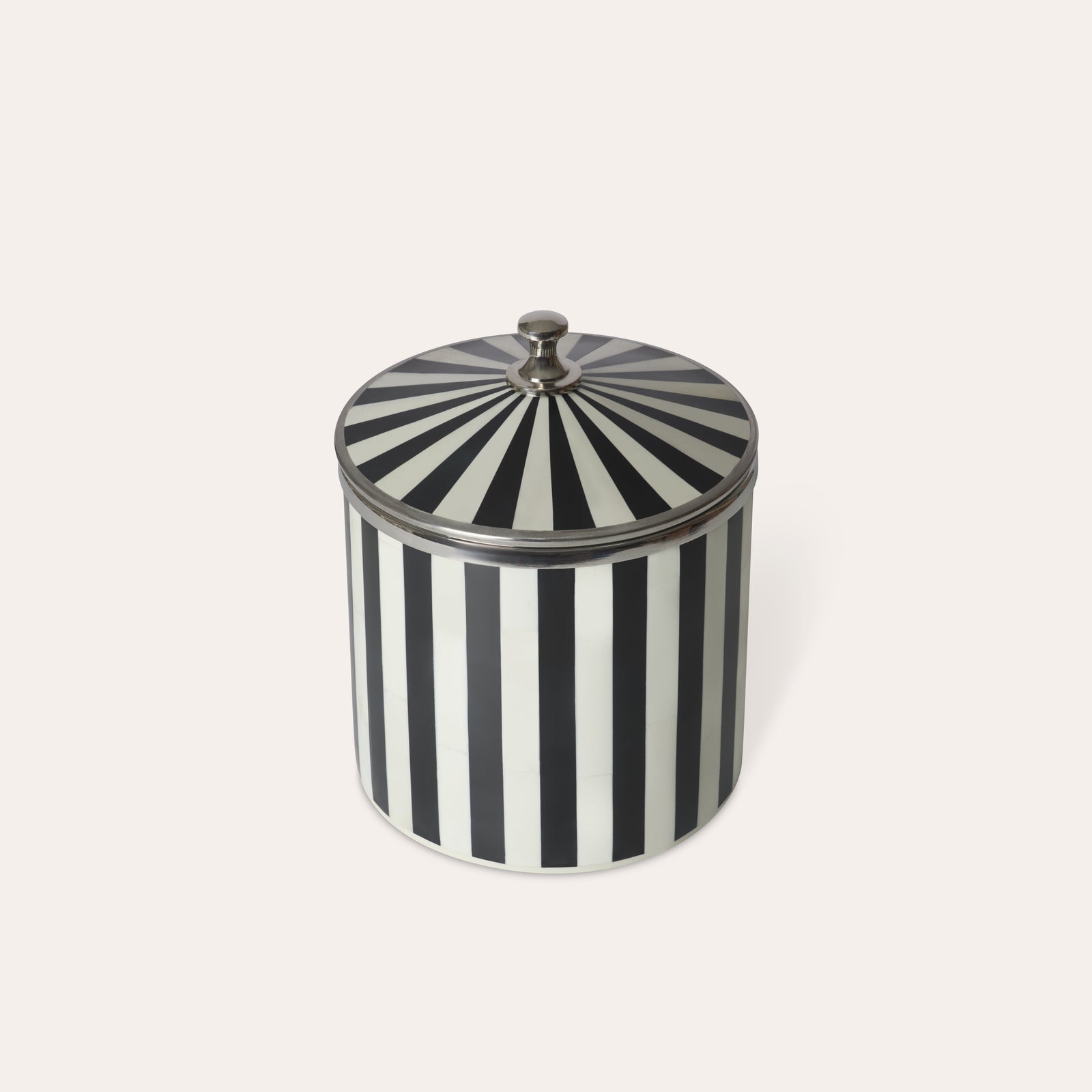 Black and white striped circular ice bucket with a lid, chrome silver details handle and edges on a light background.