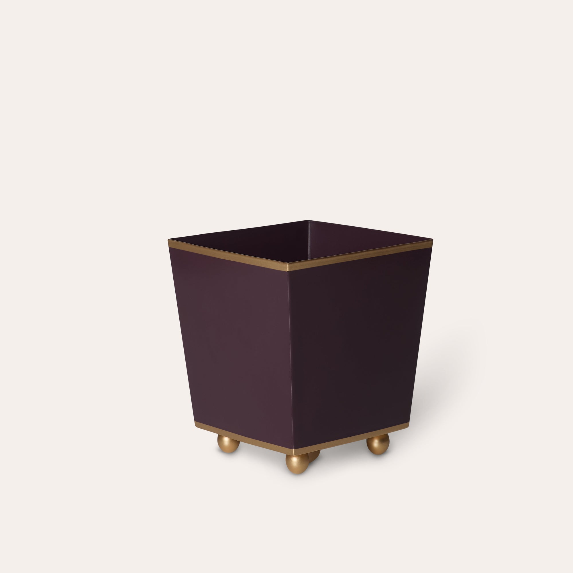 Square purple planter with gold accents on a white background