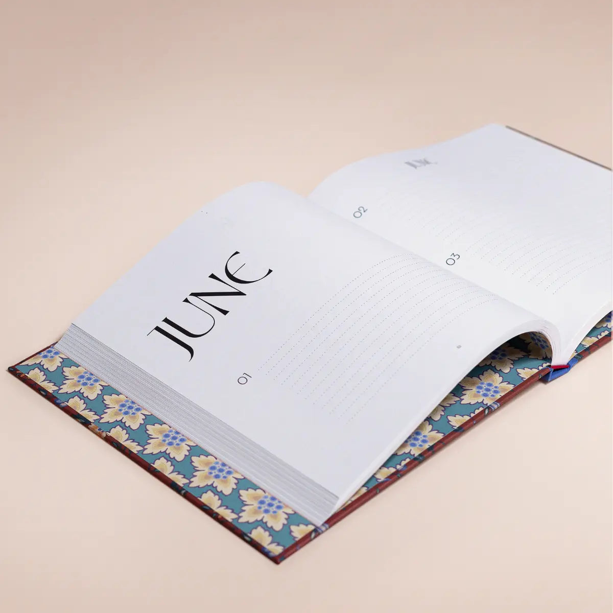 Book of Special Days Heritage Red open showing June page and premium dotted paper