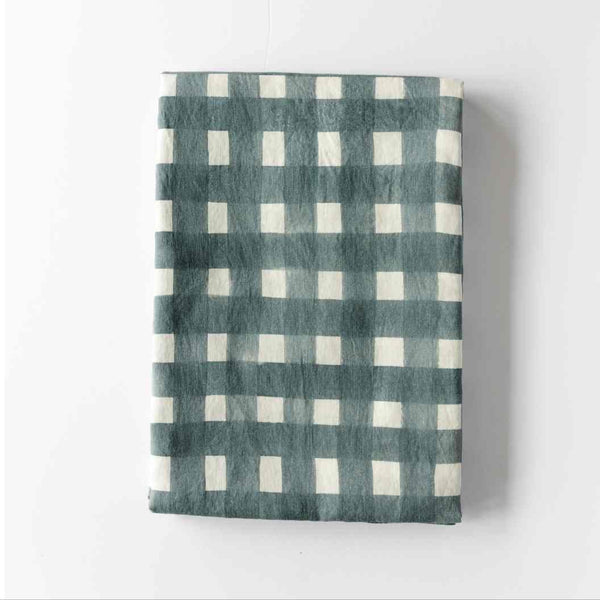 Blue Cross-Hatch linen tablecloth styled on elegant dining table - Goldie Home