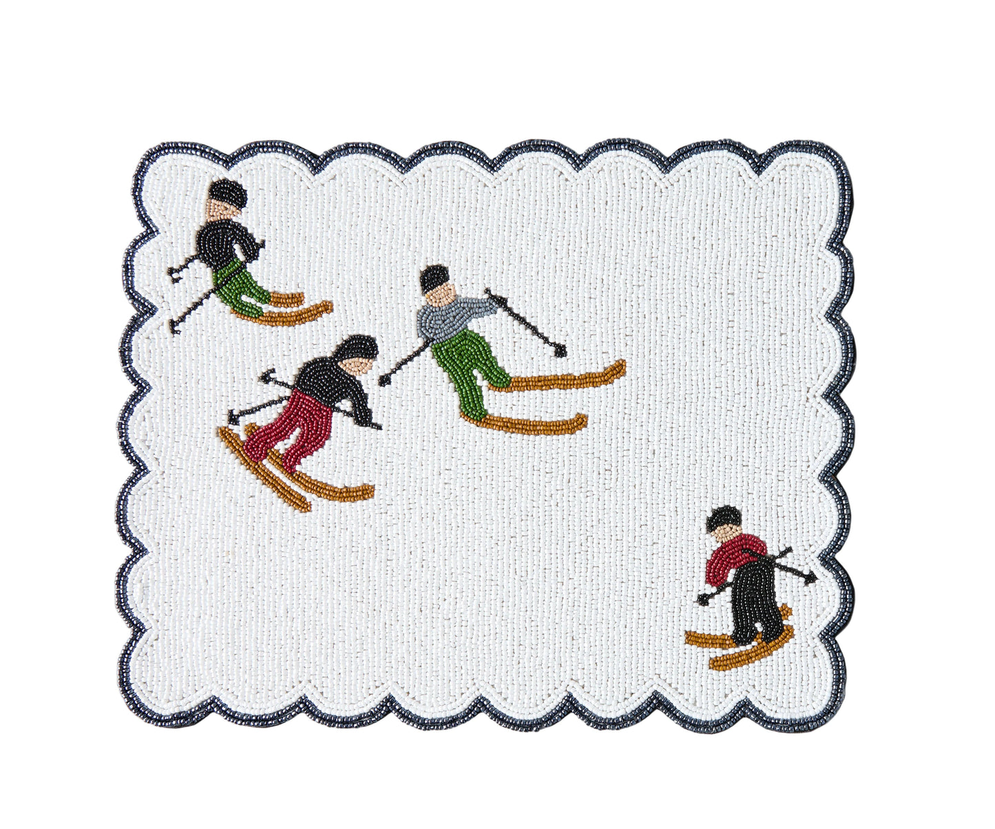 A Christmas table runner featuring a winter sports theme with skiers on a white background, bordered by a dark color.