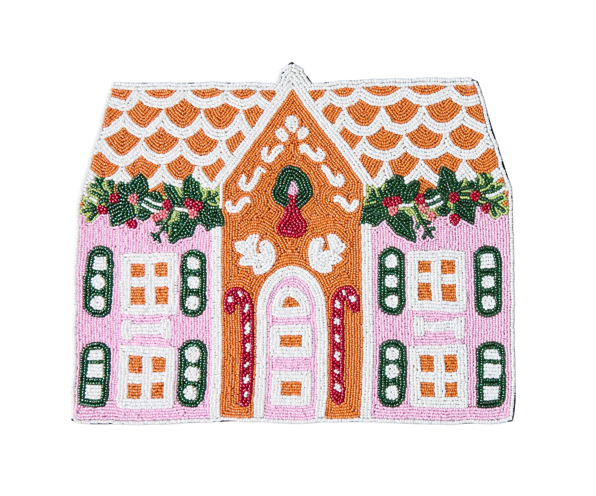 A handcrafted gingerbread house beaded placemat with intricate glass beads and a black velvet backing, featuring a festive design with a gingerbread house motif.