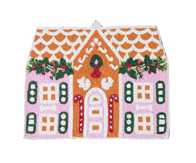 A handcrafted gingerbread house beaded placemat with intricate glass beads and a black velvet backing, featuring a festive design with a gingerbread house motif.
