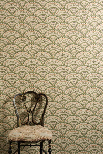 Clarice Verte wallpaper with scalloped geometric pattern in sage green, muted orange and soft black tones inspired by 1930s design