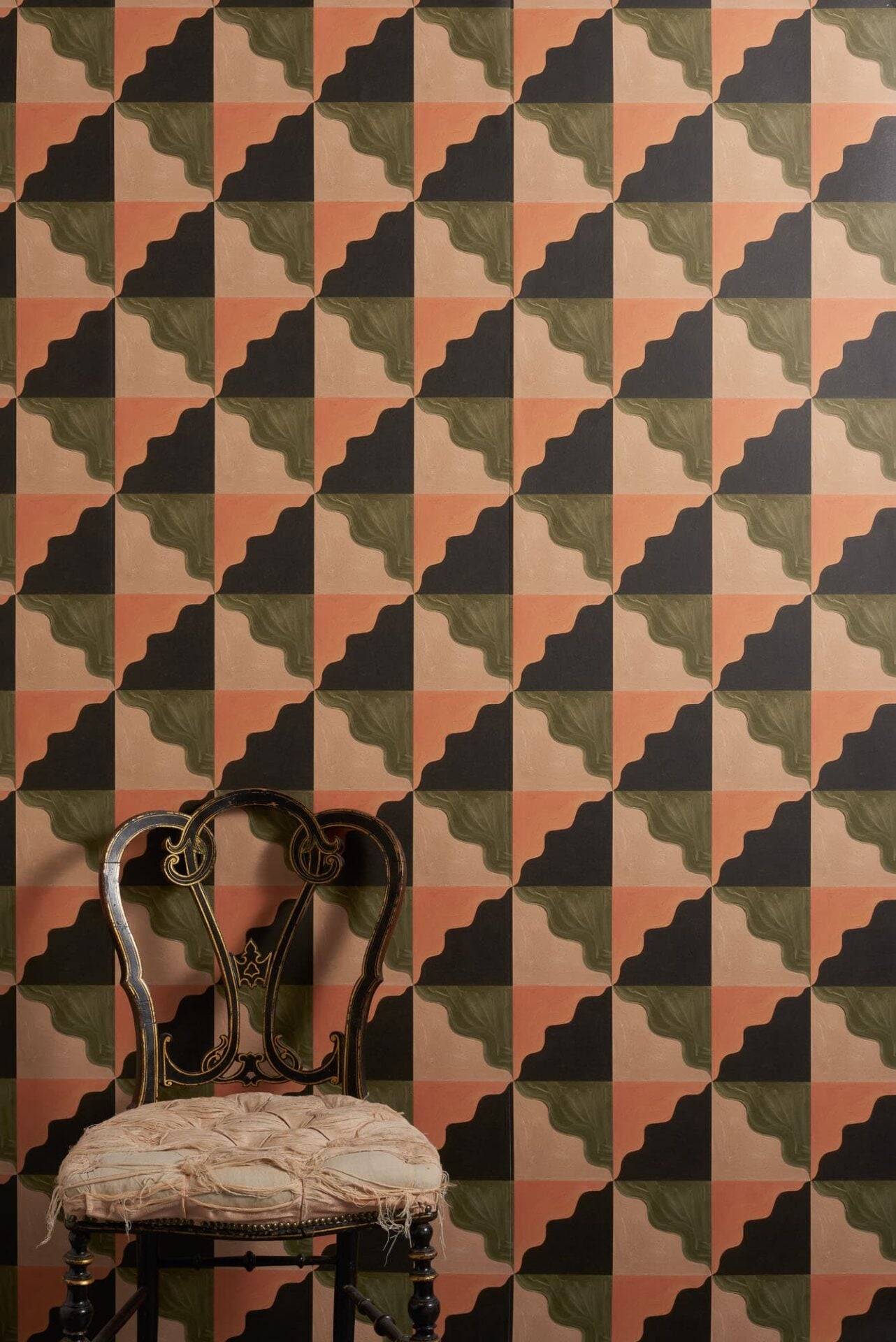 Omnes wallpaper with playful geometric pattern combining curved and straight lines in muted earthy 1930s tones with a vintage feel