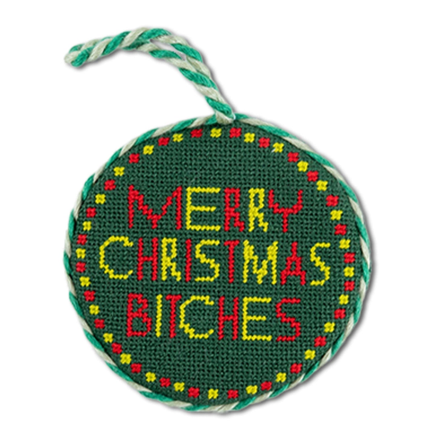 Round green needlepoint ornament with colorful text on a white background
