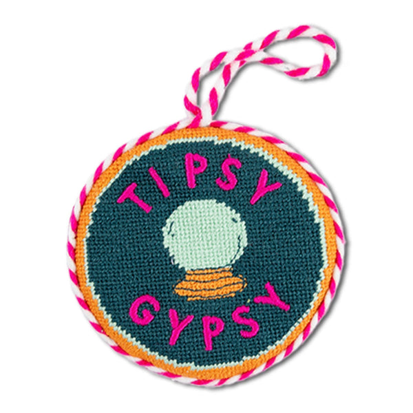 Round keychain with 'Tipsy Gypsy' text and colorful border on a white background
