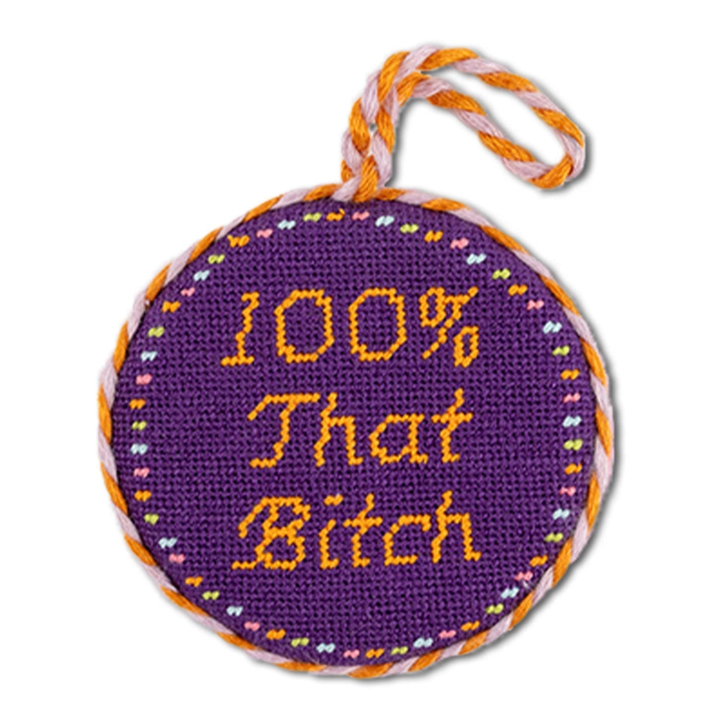 Round purple embroidered item with yellow text on a white background