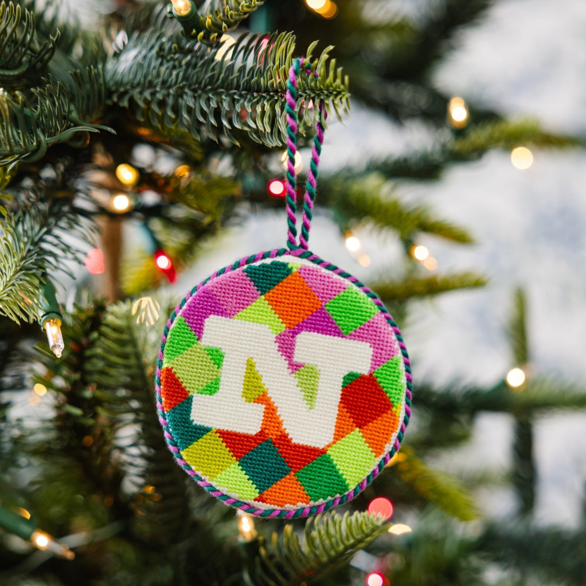 Colorful Christmas ornament with letter 'N' on a decorated tree