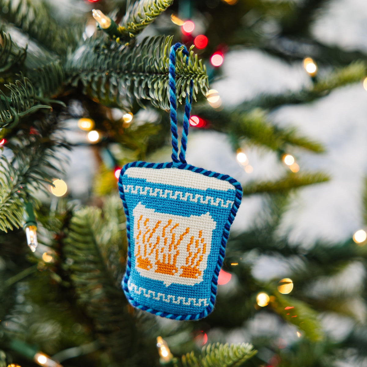Knitted Christmas ornament on a decorated tree