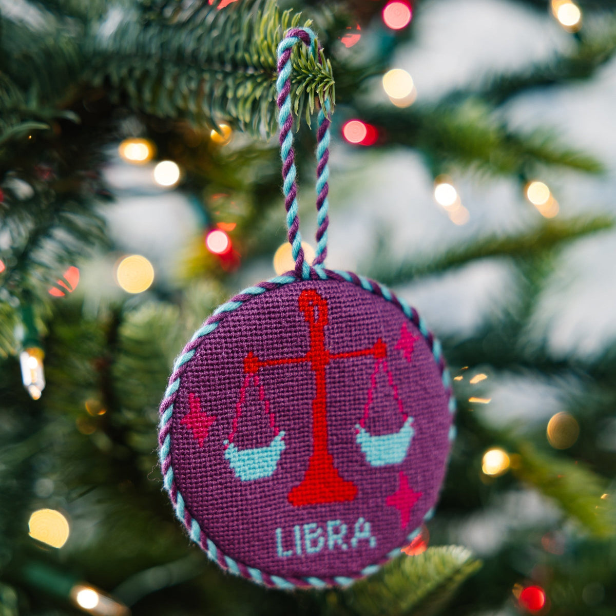 Decorative ornament with Libra zodiac sign on a Christmas tree