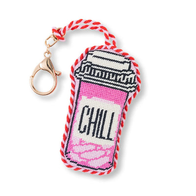 Keychain with a pink and white design and 'CHILL' text on a white background
