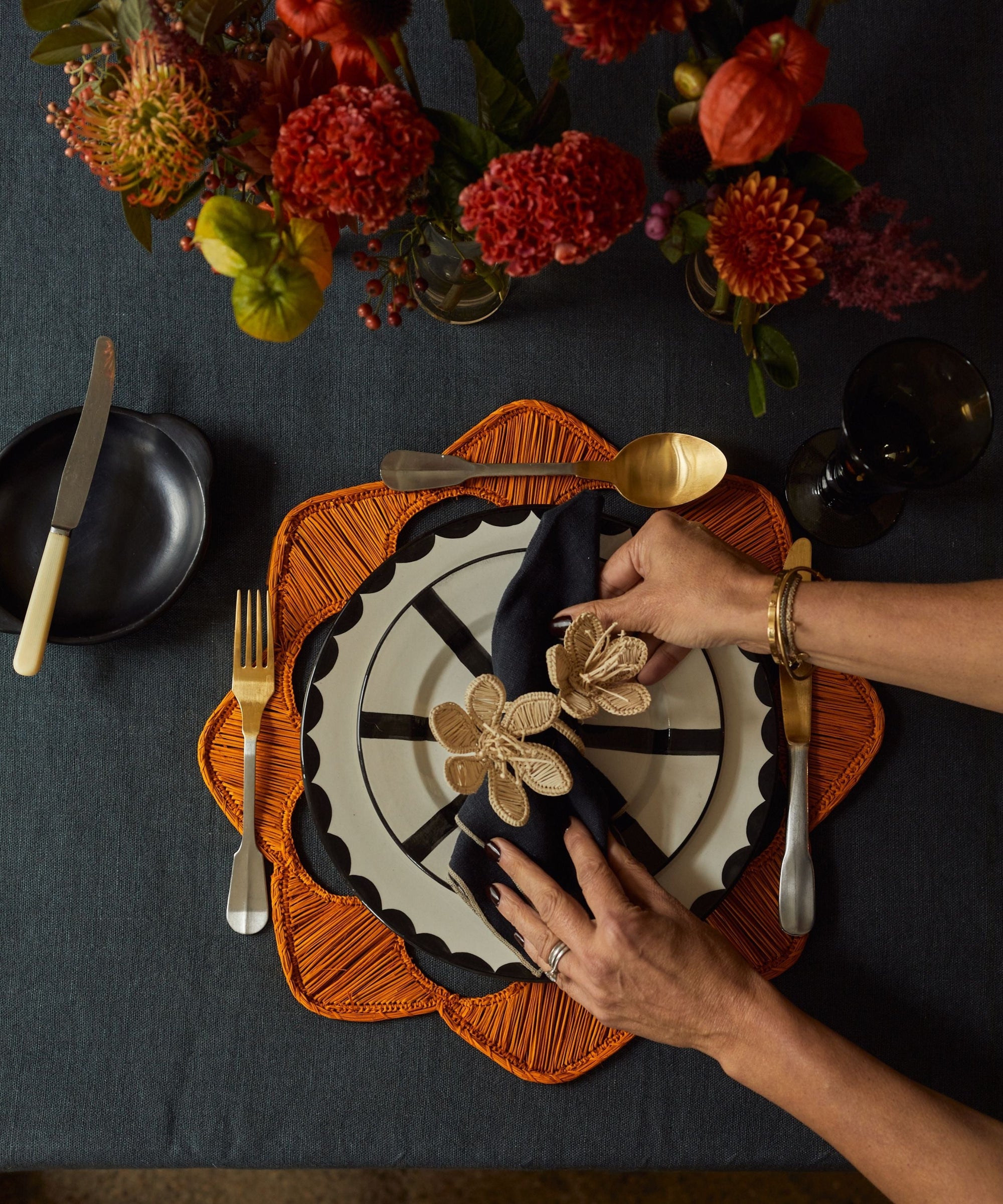 Florencia napkin ring in natural, handwoven iraca palm, on a table setting
