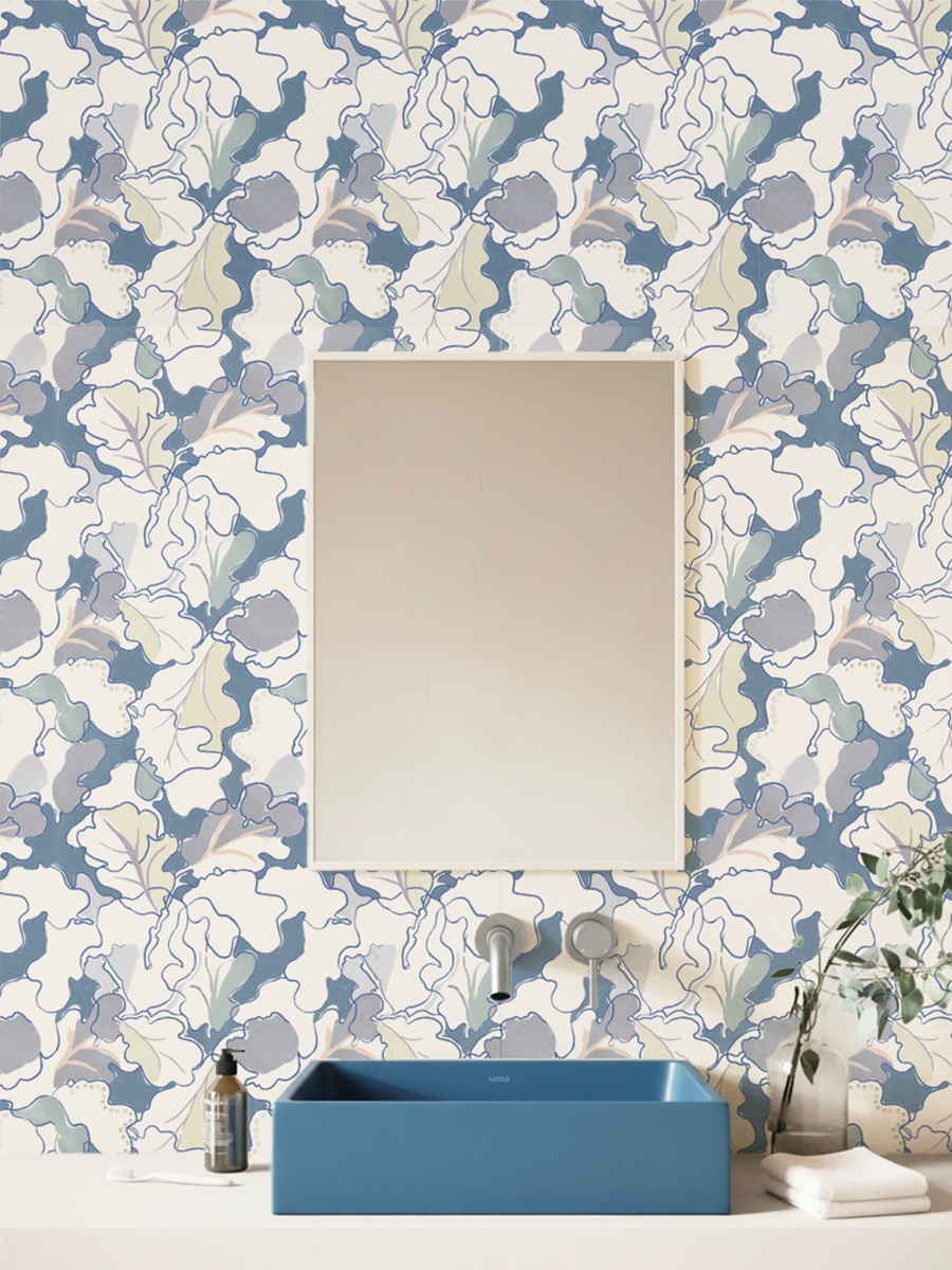 Bathroom with floral wallpaper by Lizzet Frausto, blue sink, and decorative elements.