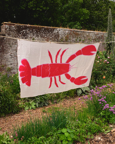 Lobster table linen hanging up on washing line