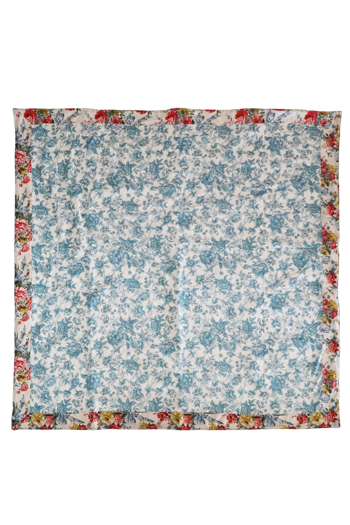Floral patterned fabric square with a colorful border on a white background