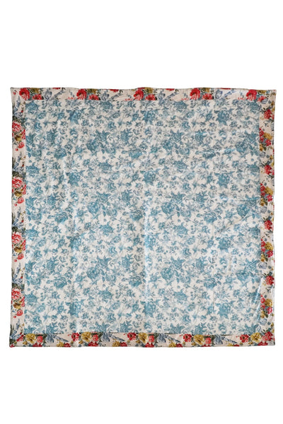 Floral patterned fabric square with a colorful border on a white background