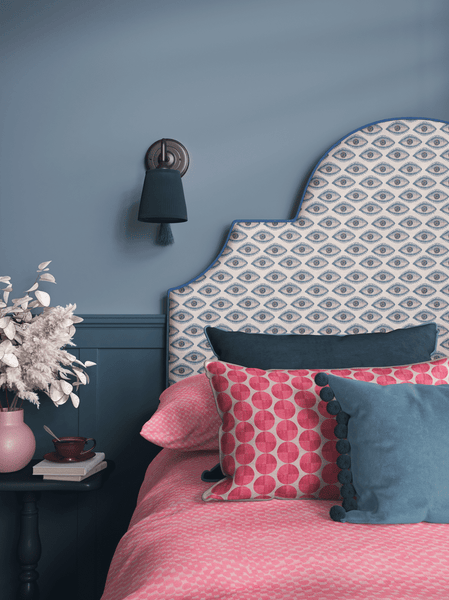 Thalia Botsari collection featuring artisanal interior textiles in a colorful bedroom