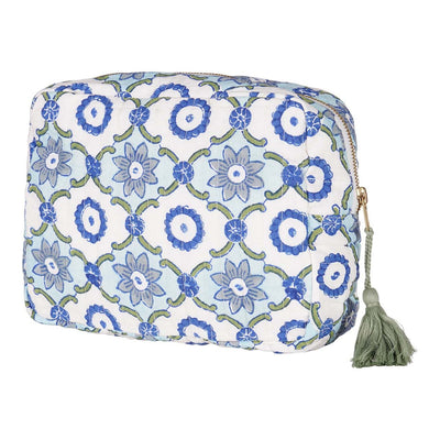 A hand block-printed cotton vanity pouch with floral patterns in blue and green hues, featuring a zipper closure with a tassel detail.