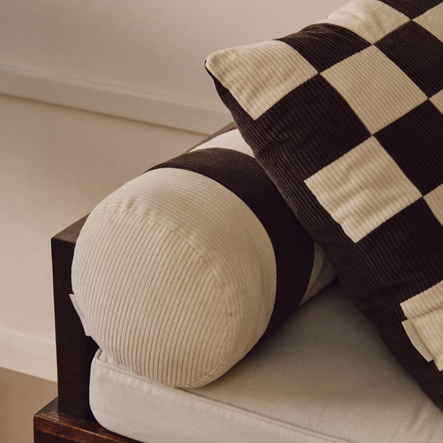 Close up shot of cream and brown cotton corduroy checkered square cushion