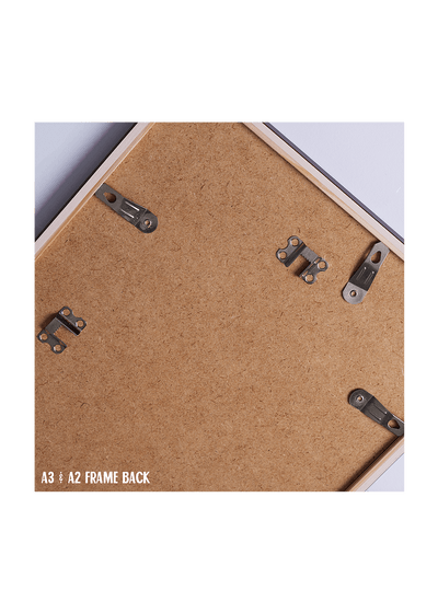 Back of a frame with metal brackets and cork surface, labeled A3/A2 frame back.