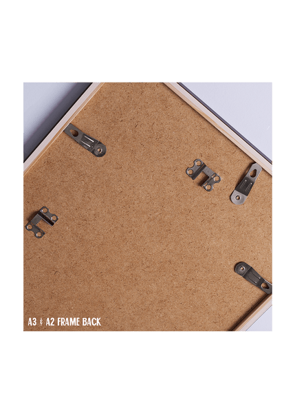 Back of a frame with metal brackets and cork surface, labeled A3/A2 frame back.