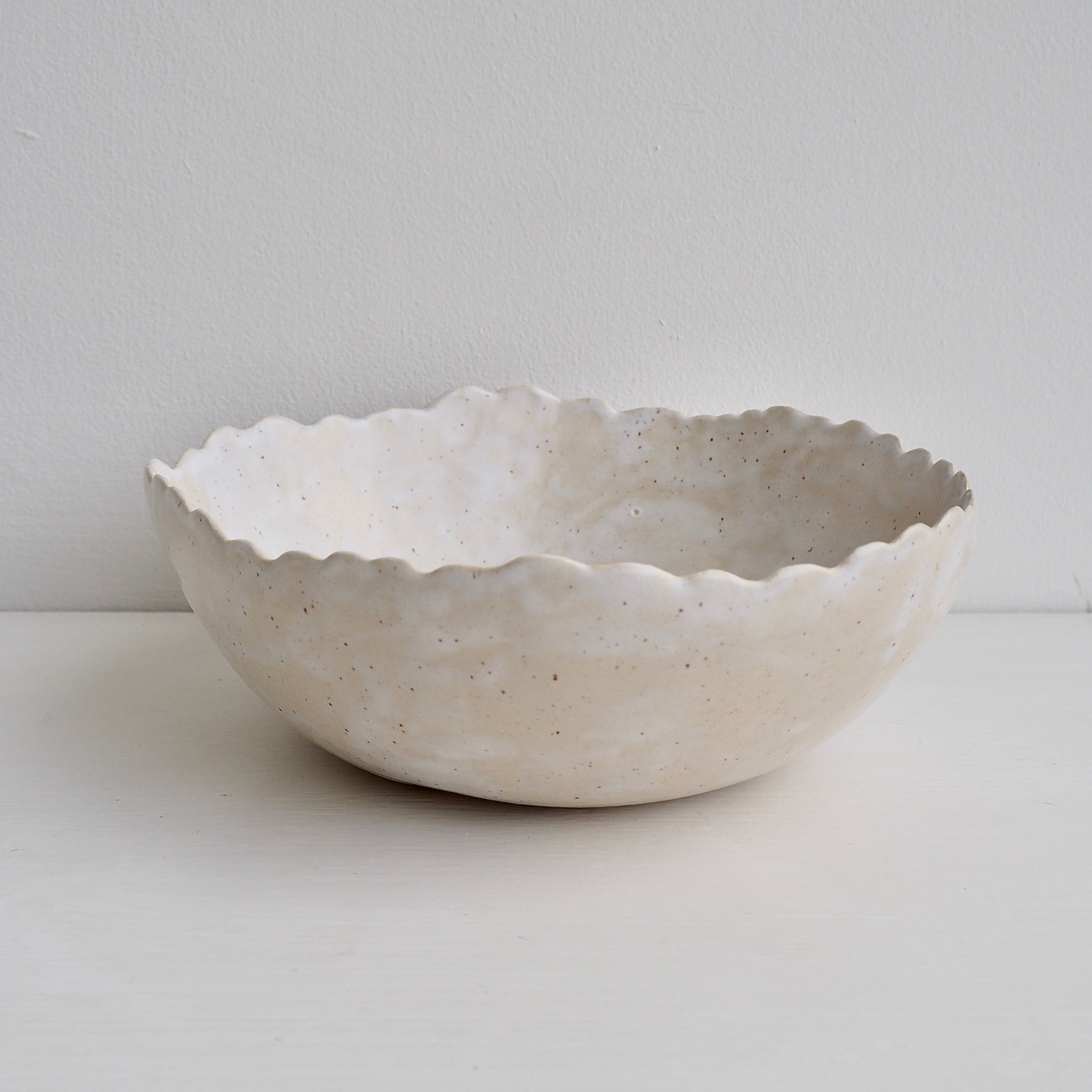 Handmade Cream/White Speckled Scalloped Ceramic Serving Bowl.