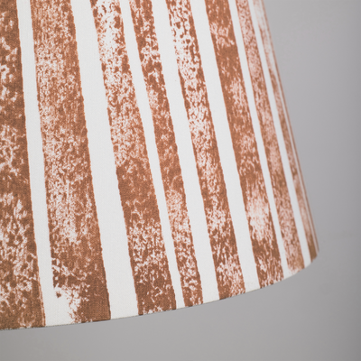 Close-up of the Devon Rock handmade lampshade showing its textured orange stripe pattern. A bold stripe lampshade with geometric detail, perfect as empire shades for table lamps, floor lamps and wall lights.