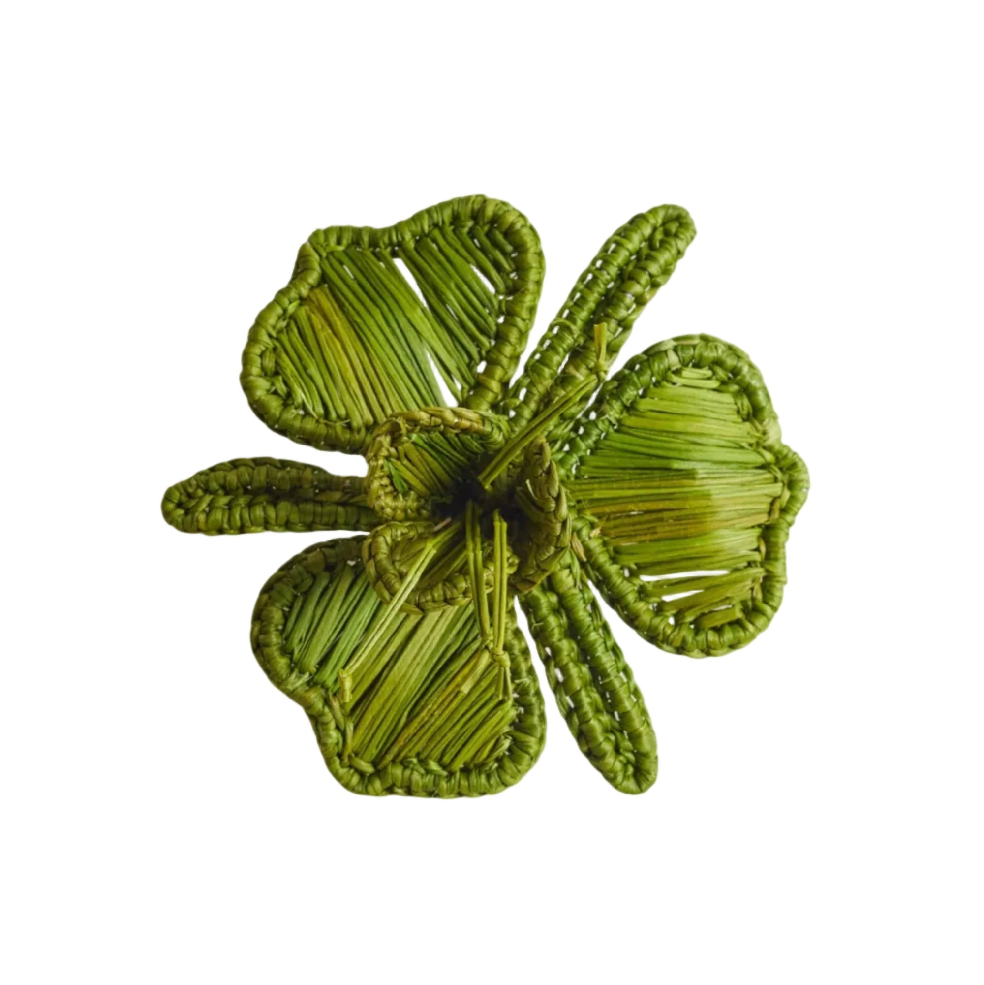 Orquidea napkin ring in green, handwoven iraca palm, holding a folded napkin