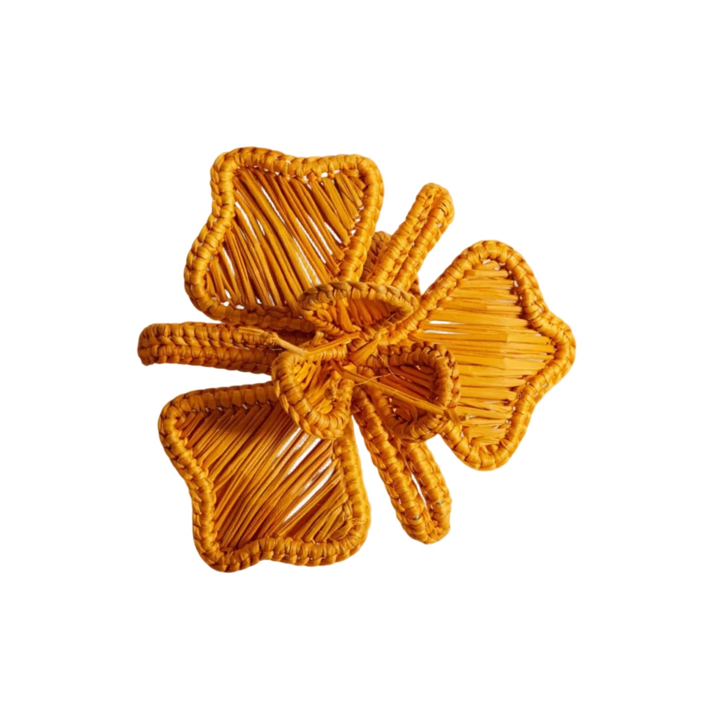 Orquidea napkin ring in mustard, handwoven iraca palm, holding a folded napkin
