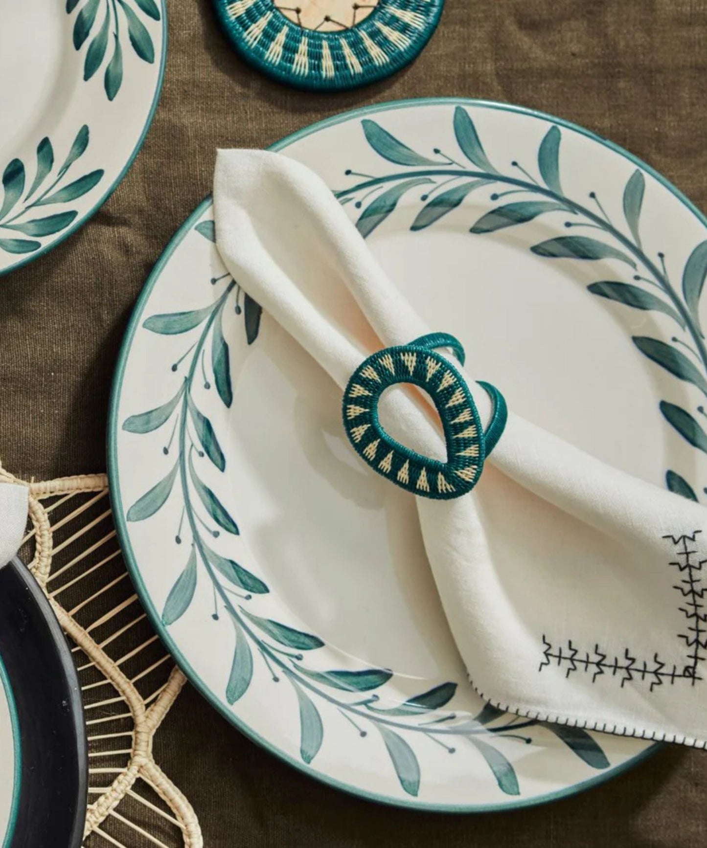 Gota Werregue napkin ring in teal, handwoven werregue palm, close-up detail
