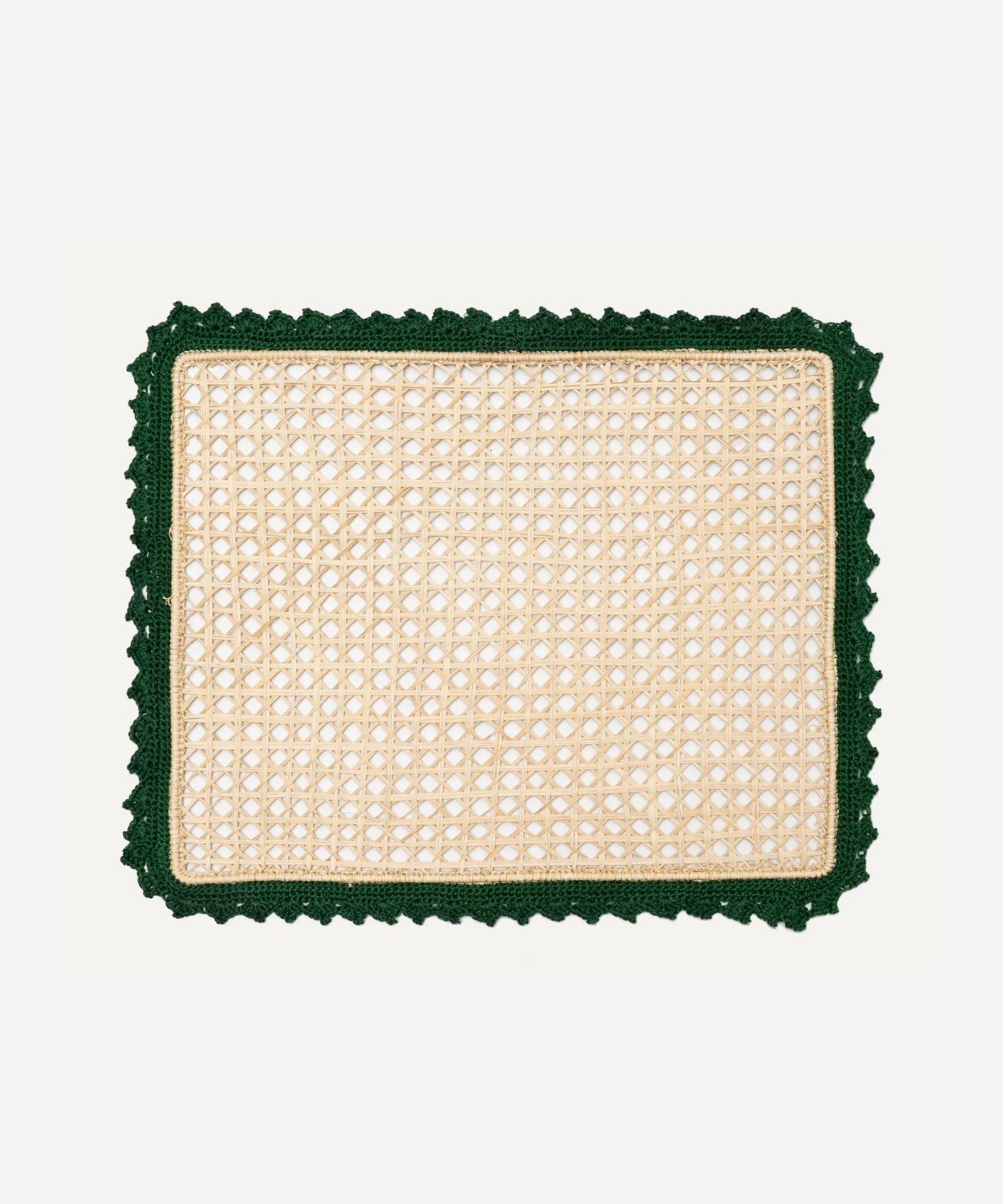 Nubia placemat in green, handwoven iraca palm, styled on a table