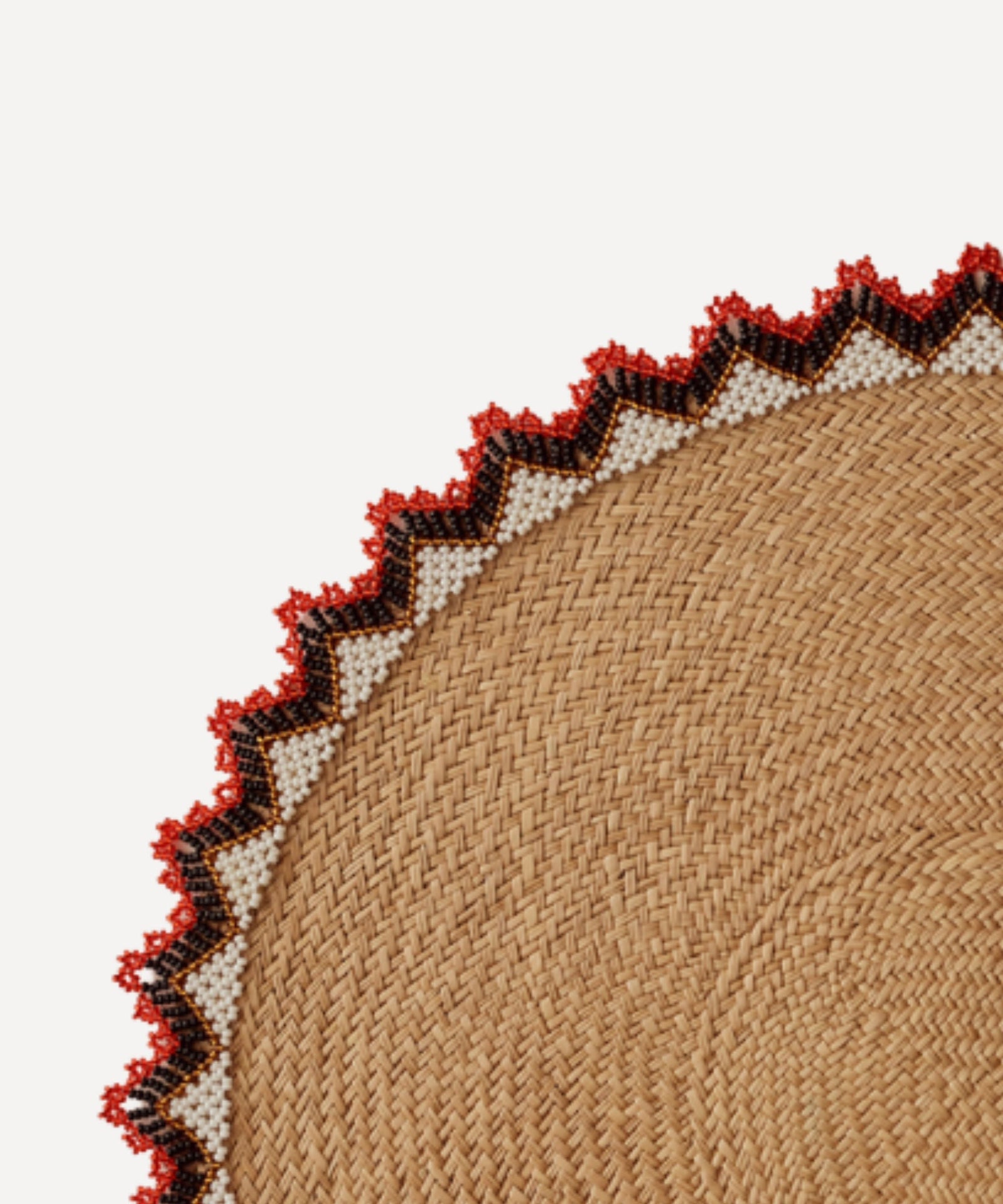 Alicia placemat in bright red, close-up of the iraca palm weave