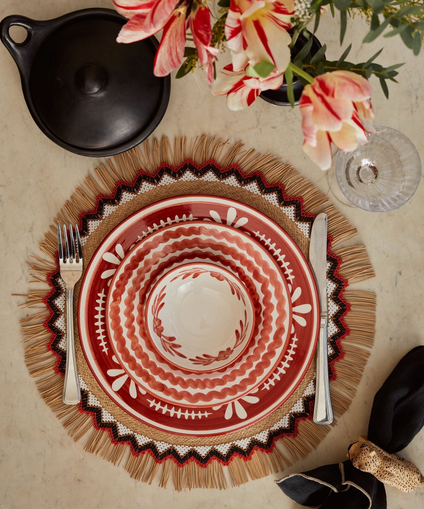 Handwoven iraca palm placemat from Usiacurí, Colombia, styled on a table