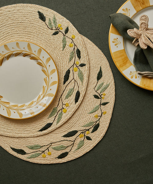 Embroidered Leaf placemat, close-up of the leaf motif and iraca weave