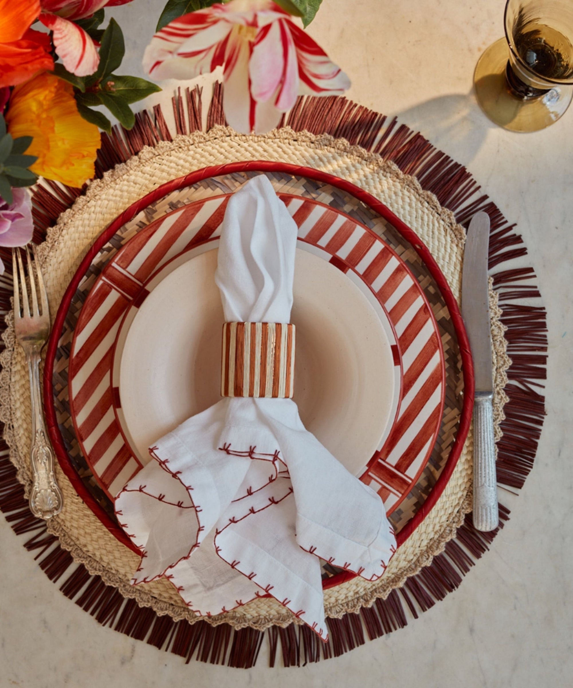 Crochet placemat in crudo, handwoven iraca palm, overhead view