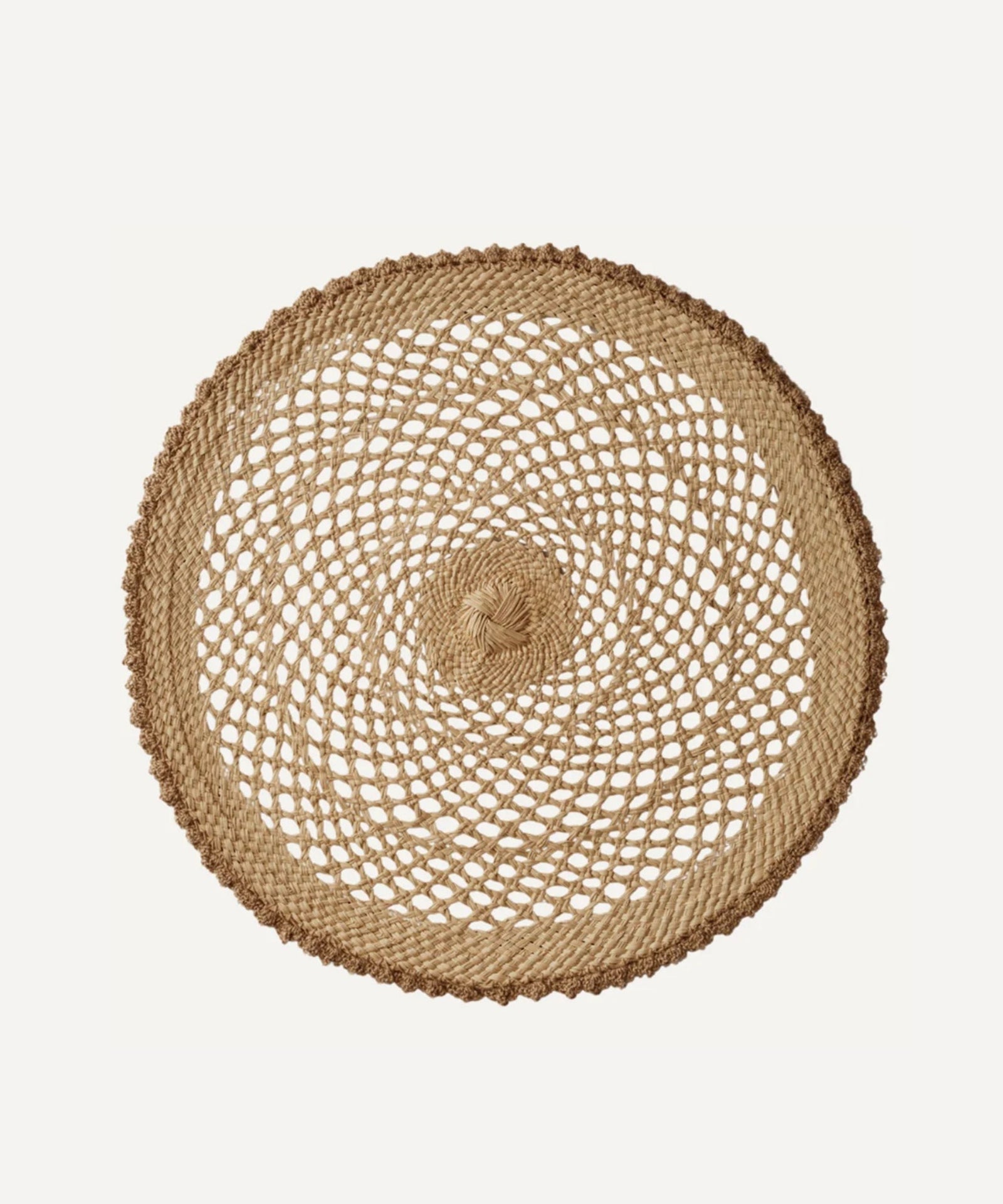 Crochet placemat in crudo, handwoven iraca palm, styled on a table
