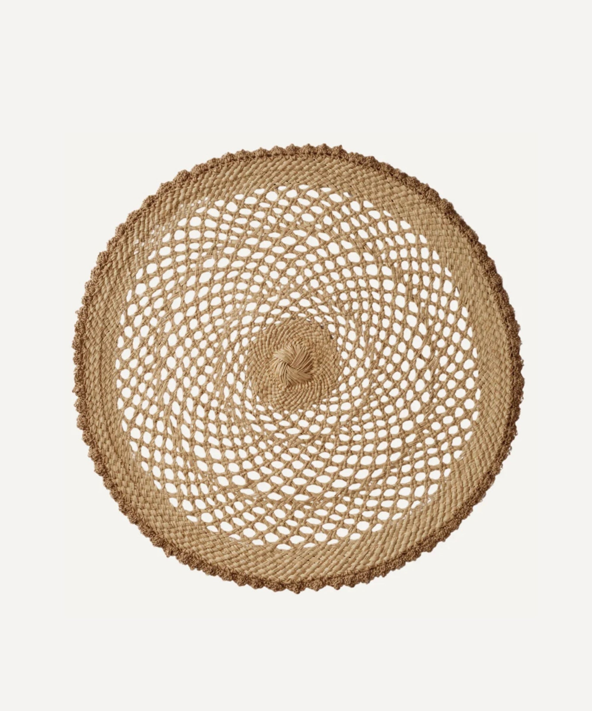 Crochet placemat in crudo, handwoven iraca palm, styled on a table