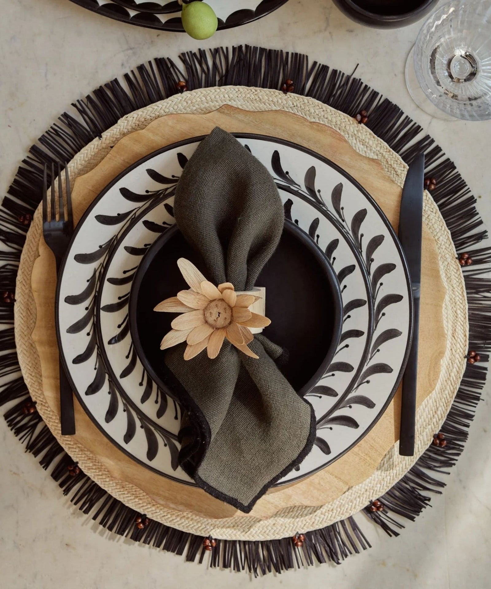 Crochet placemat in black, close-up of the iraca palm weave
