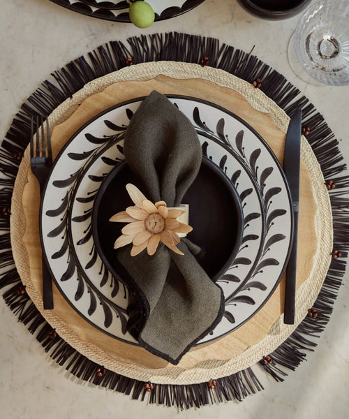 Crochet placemat in black, close-up of the iraca palm weave