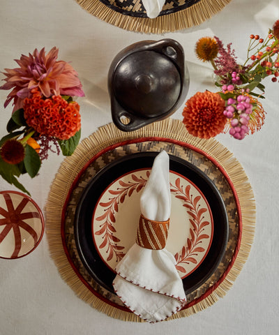 Shrimp-Eye woven charger, taupe and rust tones