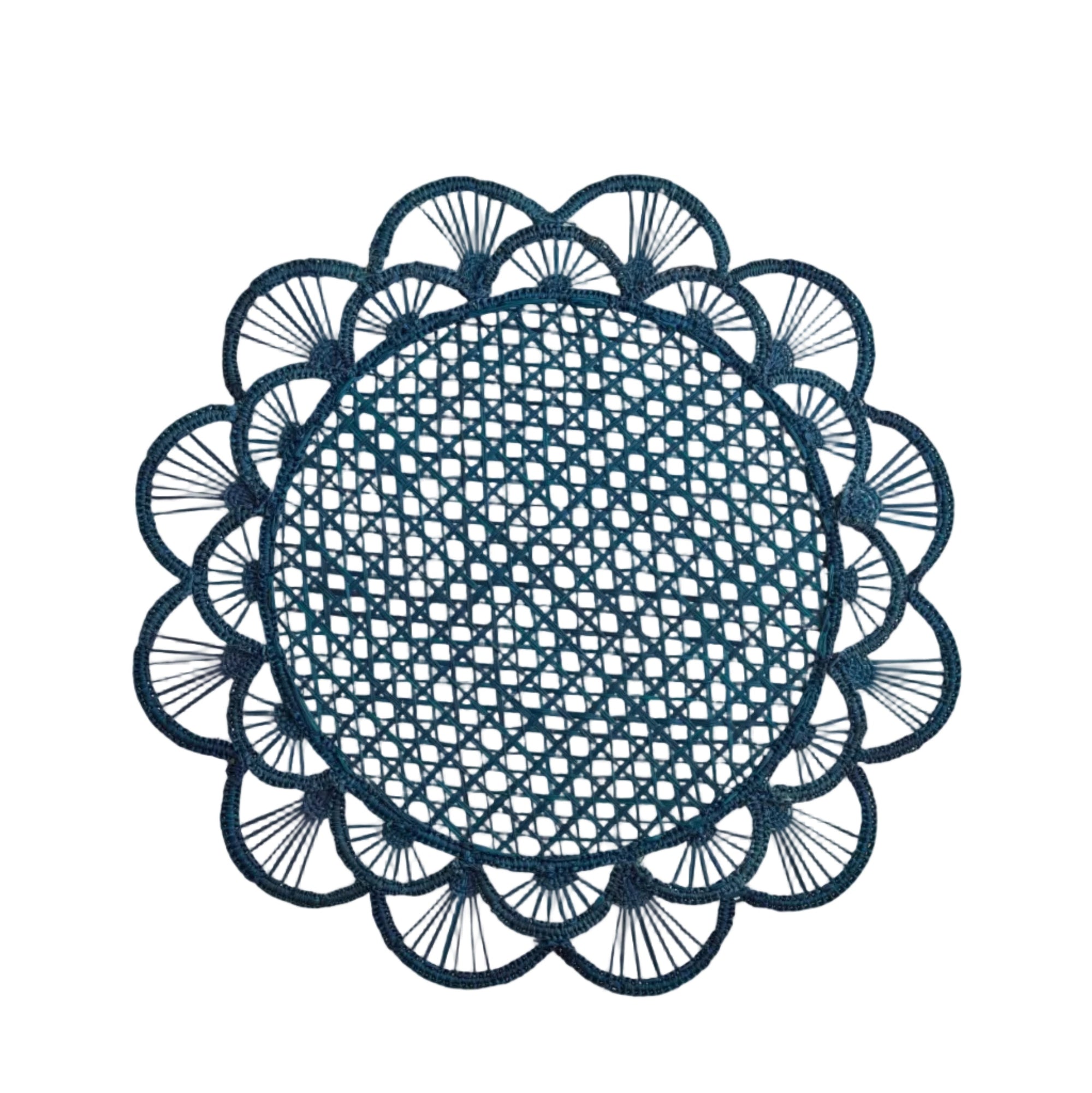 Margarita placemat in deep blue, handwoven iraca palm, styled on a table