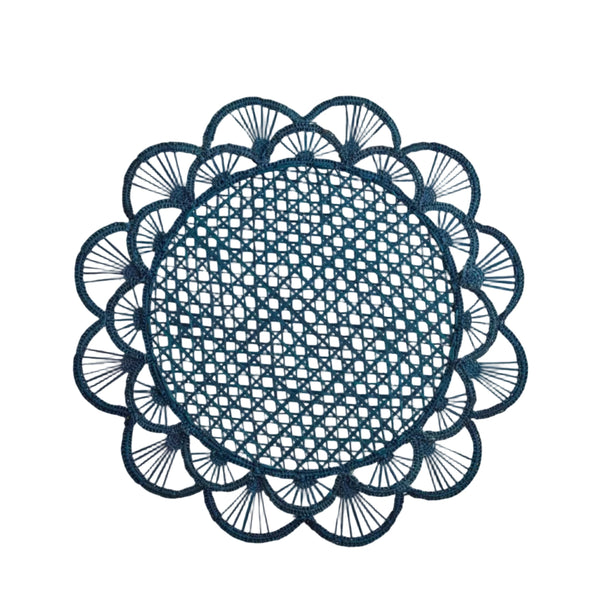 Margarita placemat in deep blue, handwoven iraca palm, styled on a table