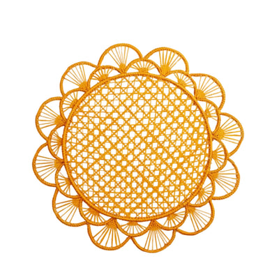 Margarita placemat in mustard, handwoven iraca palm, styled on a table